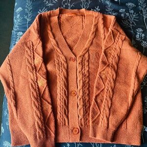 Taylor Swift orange cardigan